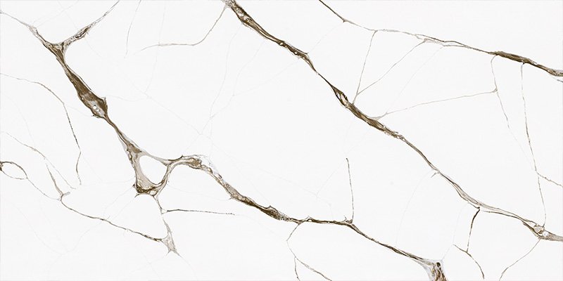 A close-up of a Calacatta quartz slab being inspected for quality under bright lights in a factory.