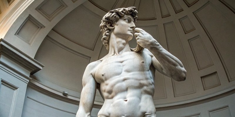A classic image of Michelangelo's David, a masterpiece carved from Carrara marble.