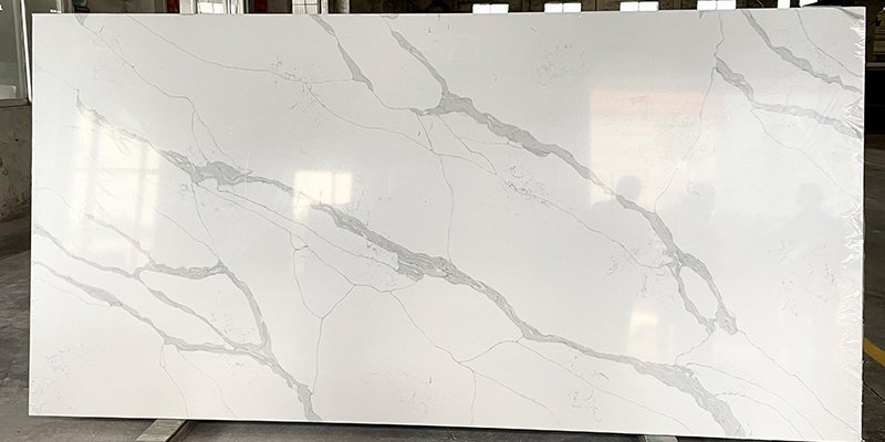 A customer choosing from a variety of quartz stone slabs