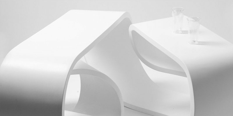 A comparison of a curved 100% acrylic solid surface and a flat modified acrylic sheet.