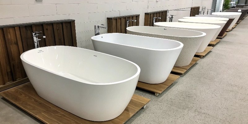 A collection of freestanding bathtubs in different materials