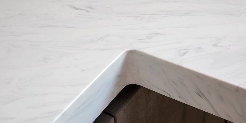 A cross-section of a solid surface countertop showing its uniform composition