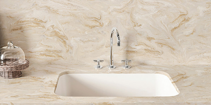 How to Clean a Solid Surface Sink Cleaning supplies next to a clean solid surface sink