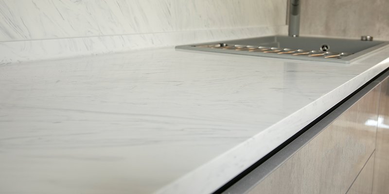 An overview of an acrylic solid surface countertop in a modern kitchen