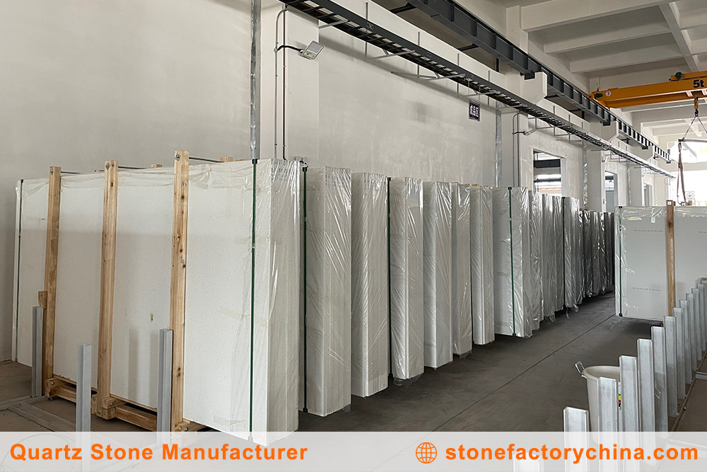 Efficient Quartz Slab Storage A neatly organized warehouse with stacks of quartz slabs, highlighting efficient inventory management.